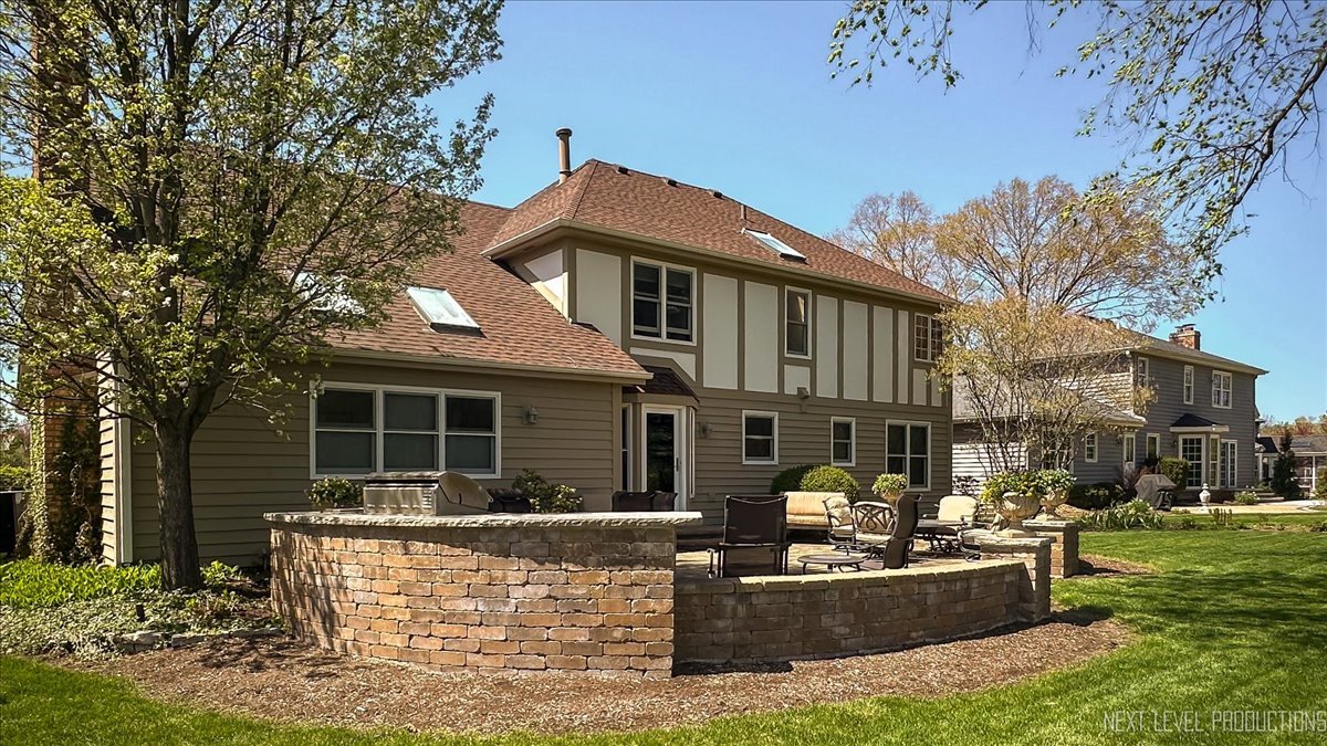 87 Hawkins Circle Wheaton, IL 60189 - Photo 33 of 42 a front view of a house with patio
