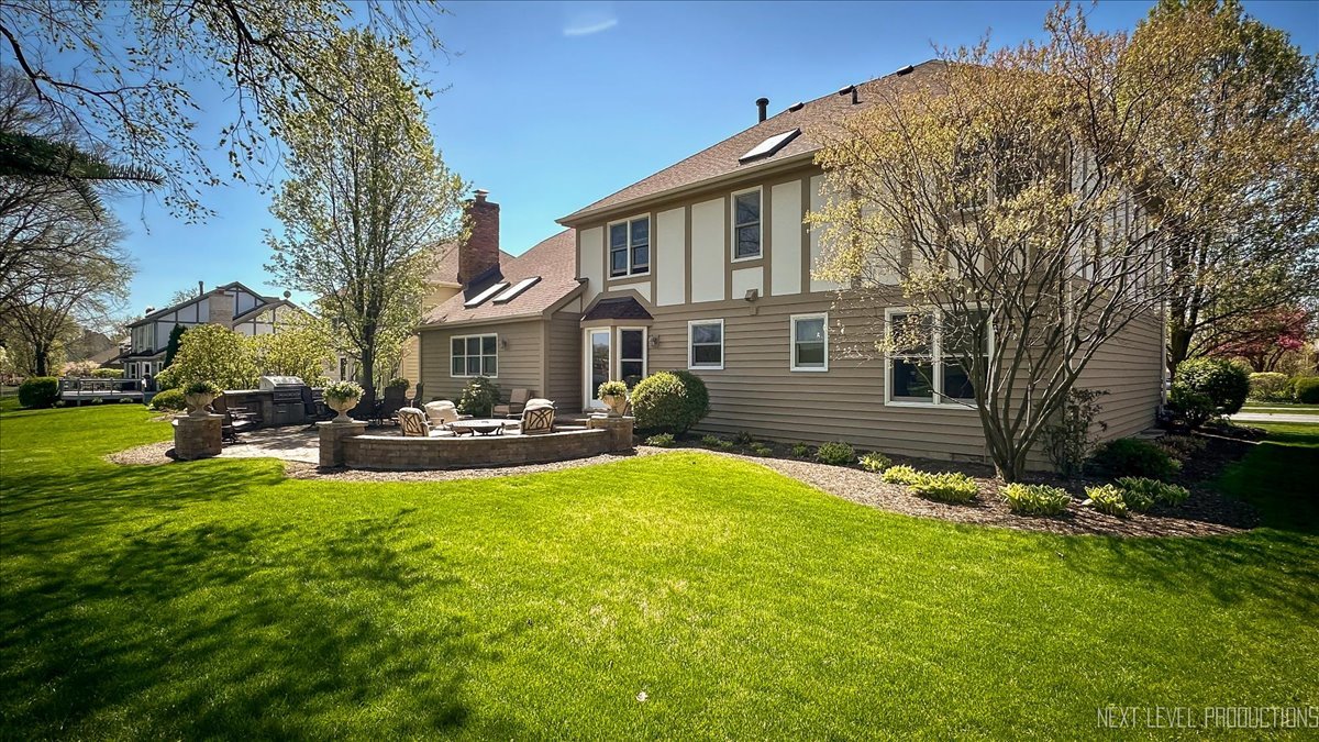 87 Hawkins Circle Wheaton, IL 60189 - Photo 34 of 42 a view of a house with a yard