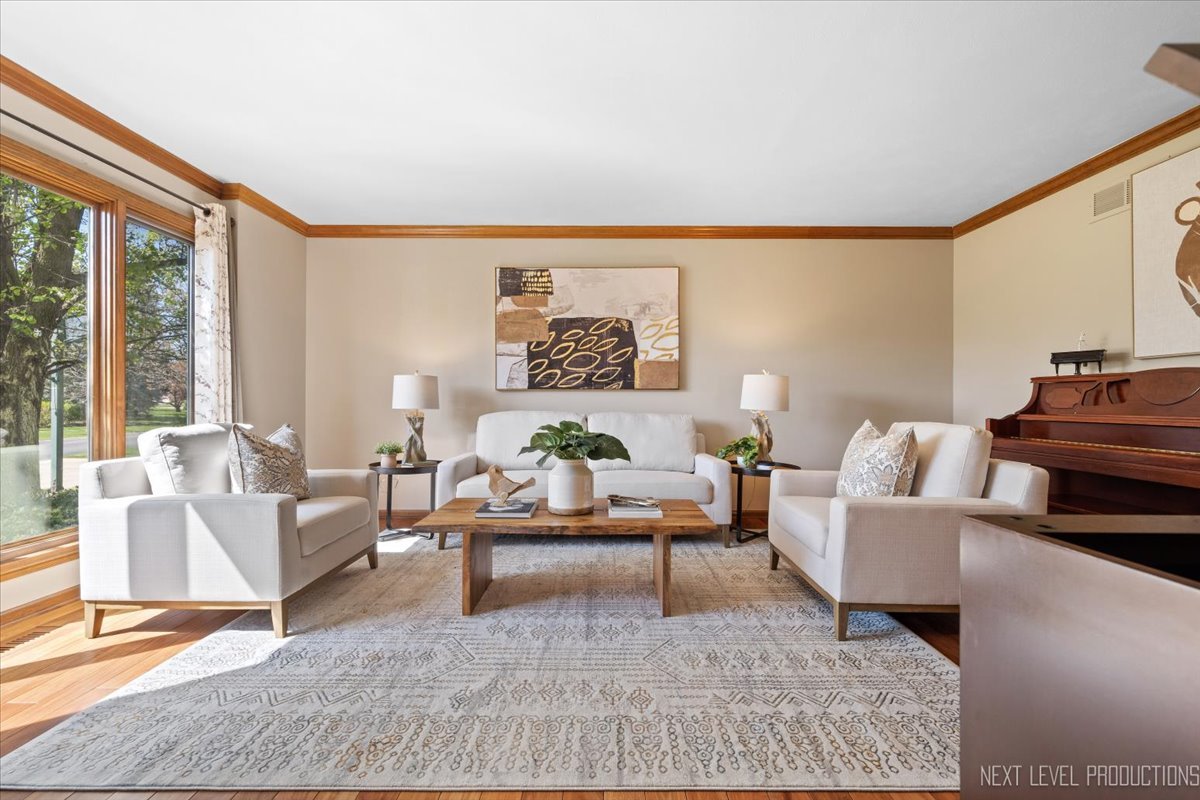 87 Hawkins Circle Wheaton, IL 60189 - Photo 5 of 42 a living room with furniture and a large window