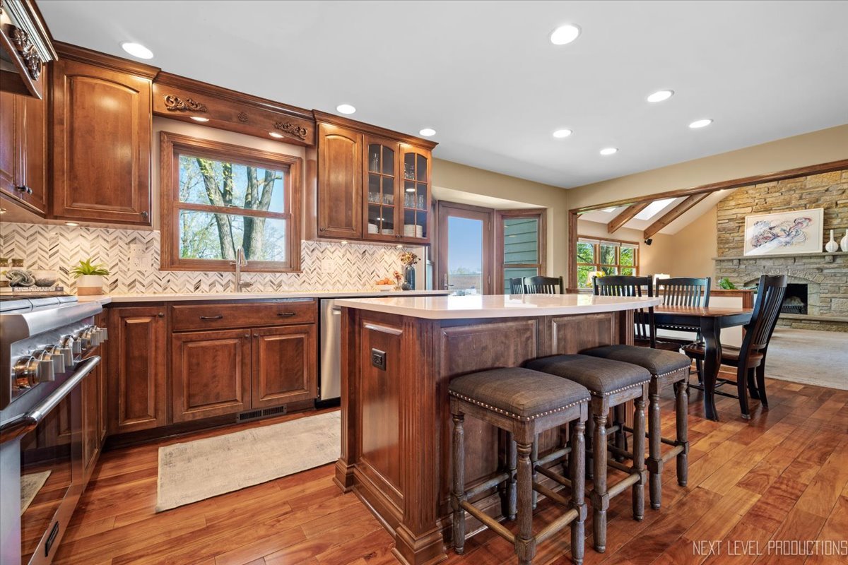 87 Hawkins Circle Wheaton, IL 60189 - Photo 7 of 42 a kitchen with a table chairs sink and cabinets