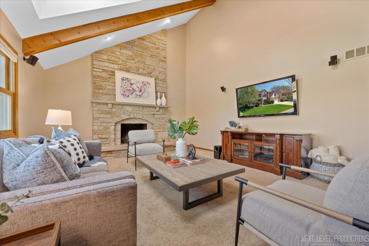 87 Hawkins Circle Wheaton, IL 60189 - Photo 9 of 42 a living room with furniture and a flat screen tv
