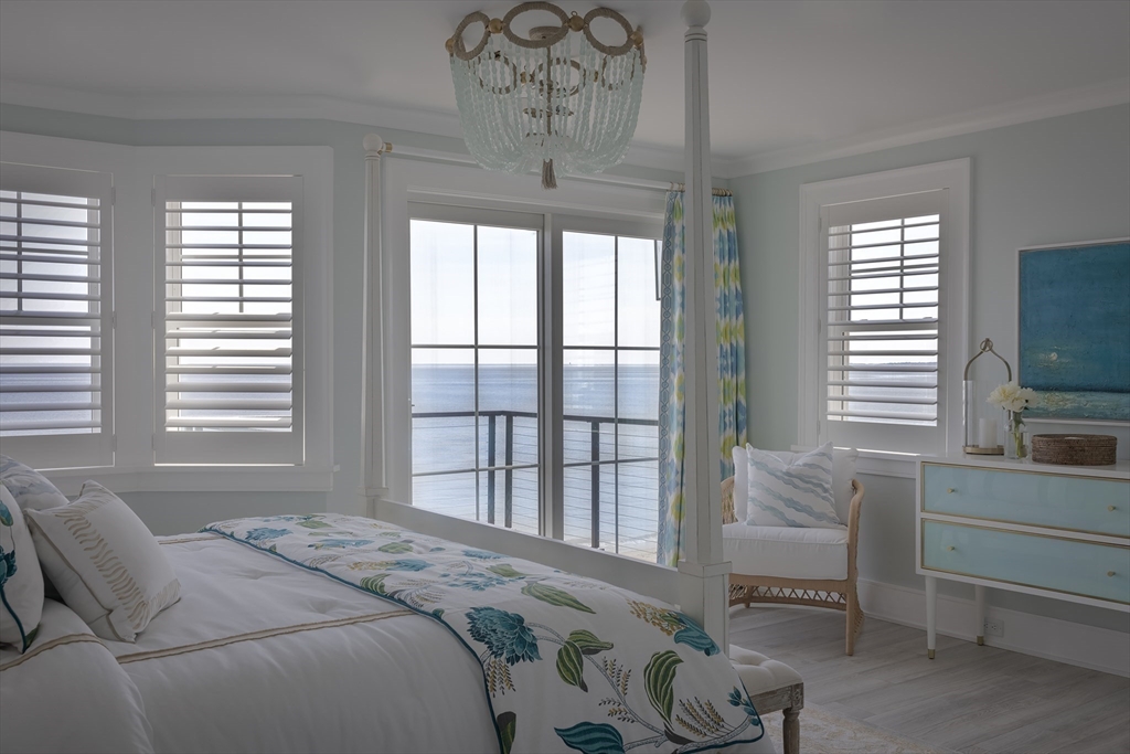 353 Beach Avenue Hull, MA 02045 - Photo 15 of 30 a bedroom with a bed and a television