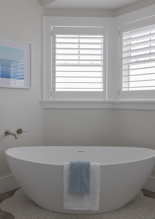 353 Beach Avenue Hull, MA 02045 - Photo 16 of 30 a bathroom with bathtub and window