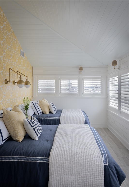 353 Beach Avenue Hull, MA 02045 - Photo 21 of 30 a bedroom with furniture and a window