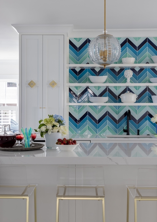 353 Beach Avenue Hull, MA 02045 - Photo 9 of 30 a table with wine bottles and glasses on it