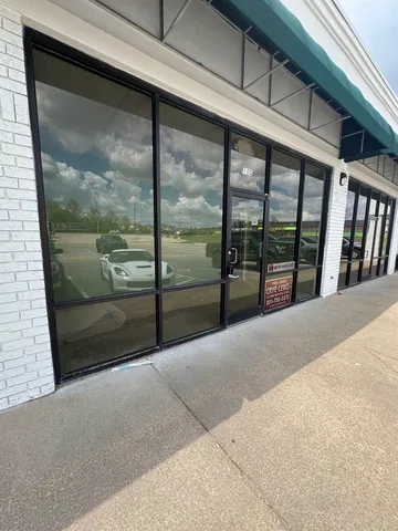 a view of a glass door with a balcony