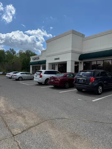 a view of cars parked in front of a building