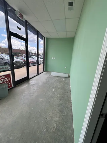 a view of an empty room with a balcony