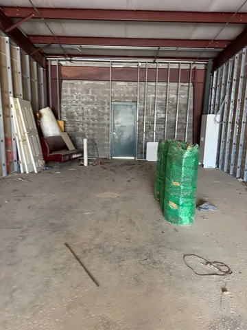 a view of a room with furniture and a potted plant