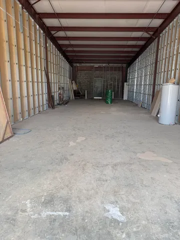 a view of an empty room with stairs