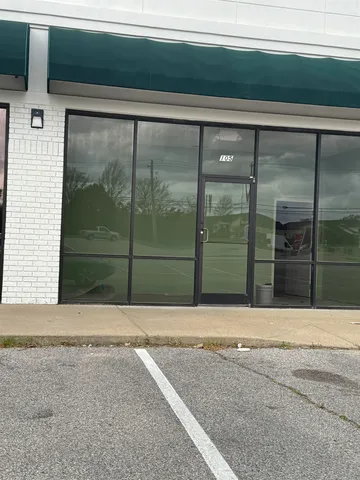 a view of entrance gate of a house