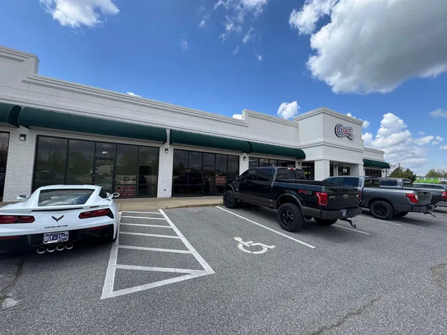 a living room with furniture a window and a ceiling fan