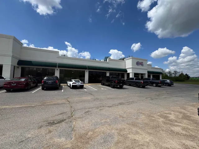 a view of a car parked in front of a building