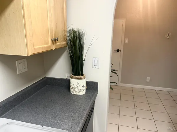 a view of a kitchen with a sink and a window