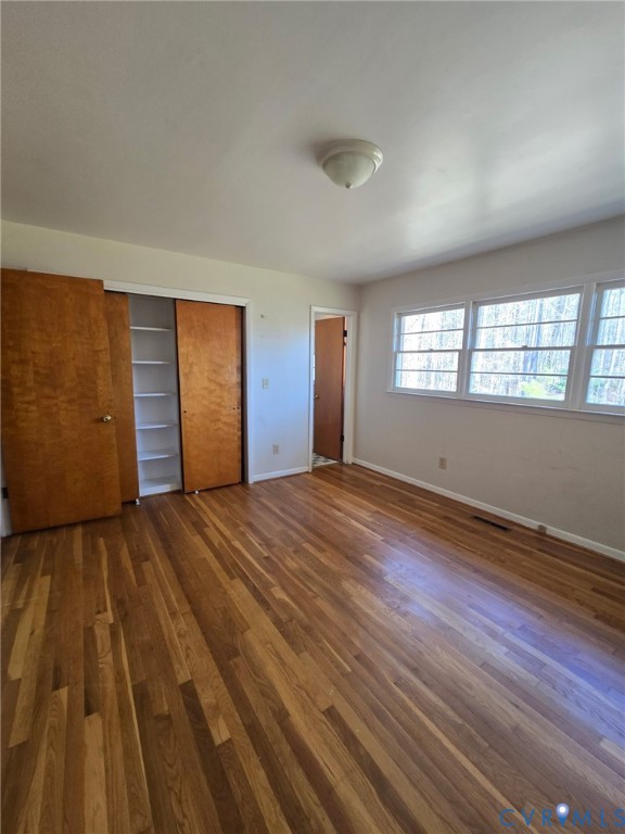 19247 Courthouse Road Yale, VA 23897 - Photo 5 of 6 Unfurnished bedroom featuring dark wood-style floo