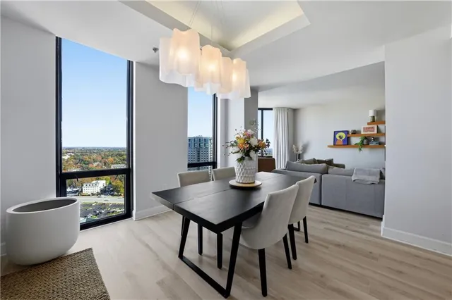 a dining room with furniture and wooden floor