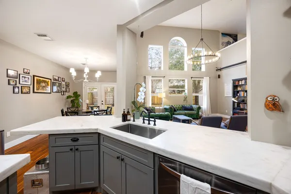 a kitchen with a sink and a large window