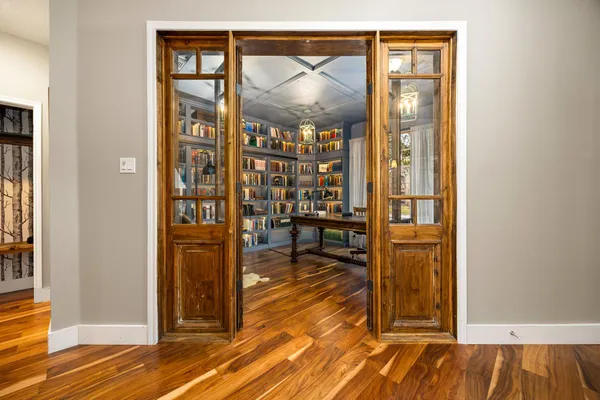 a view of living room filled with furniture and wooden floor