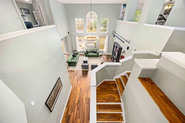 a view of a living room with furniture and a fireplace