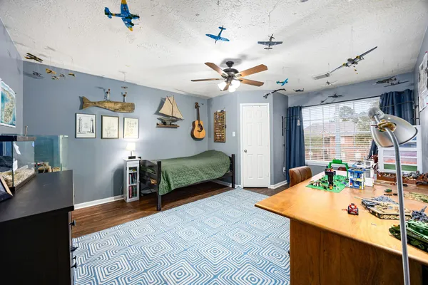 a bedroom with furniture and a chandelier