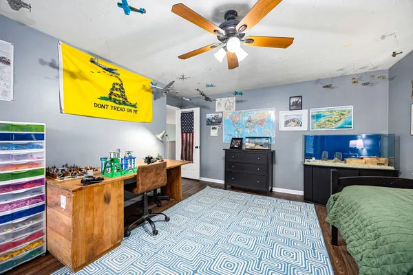 a kitchen with a refrigerator and a dining table