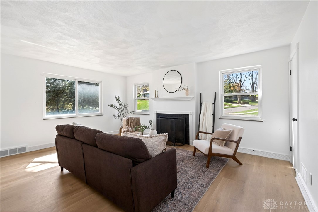 1243 Ridgeview Avenue Dayton, OH 45409 - Photo 10 of 56 This bright living area features abundant natural light and a charming fireplace.