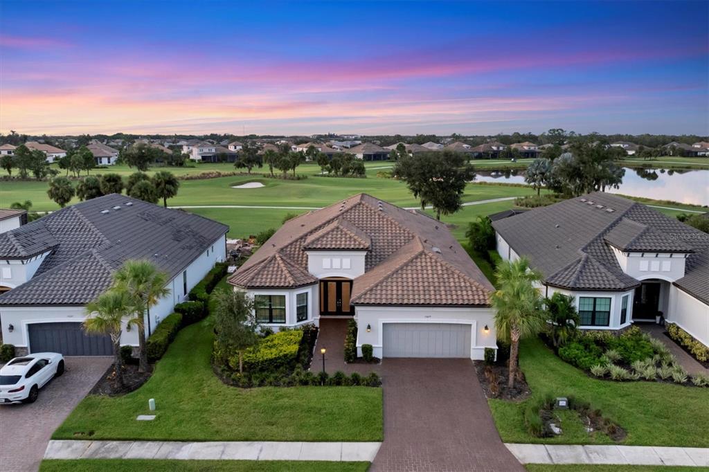 15029 Montello Way Lakewood Ranch, FL 34211 - Photo 1 of 1 an aerial view of a house with a yard and lake view