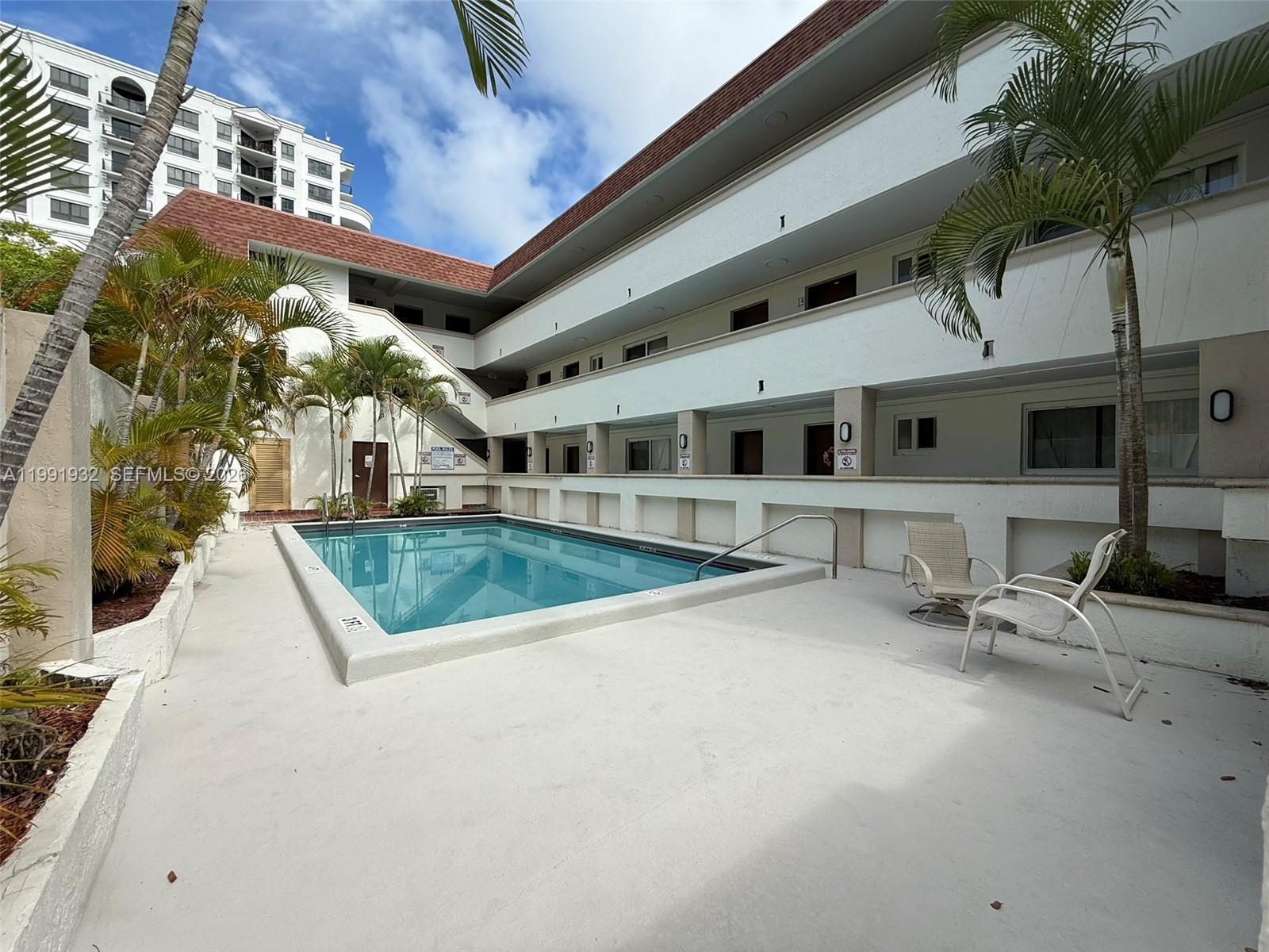 7251 Southwest 82nd Street, Unit 15 Miami, FL 33143 - Photo 14 of 15 a view of a building with a outdoor space