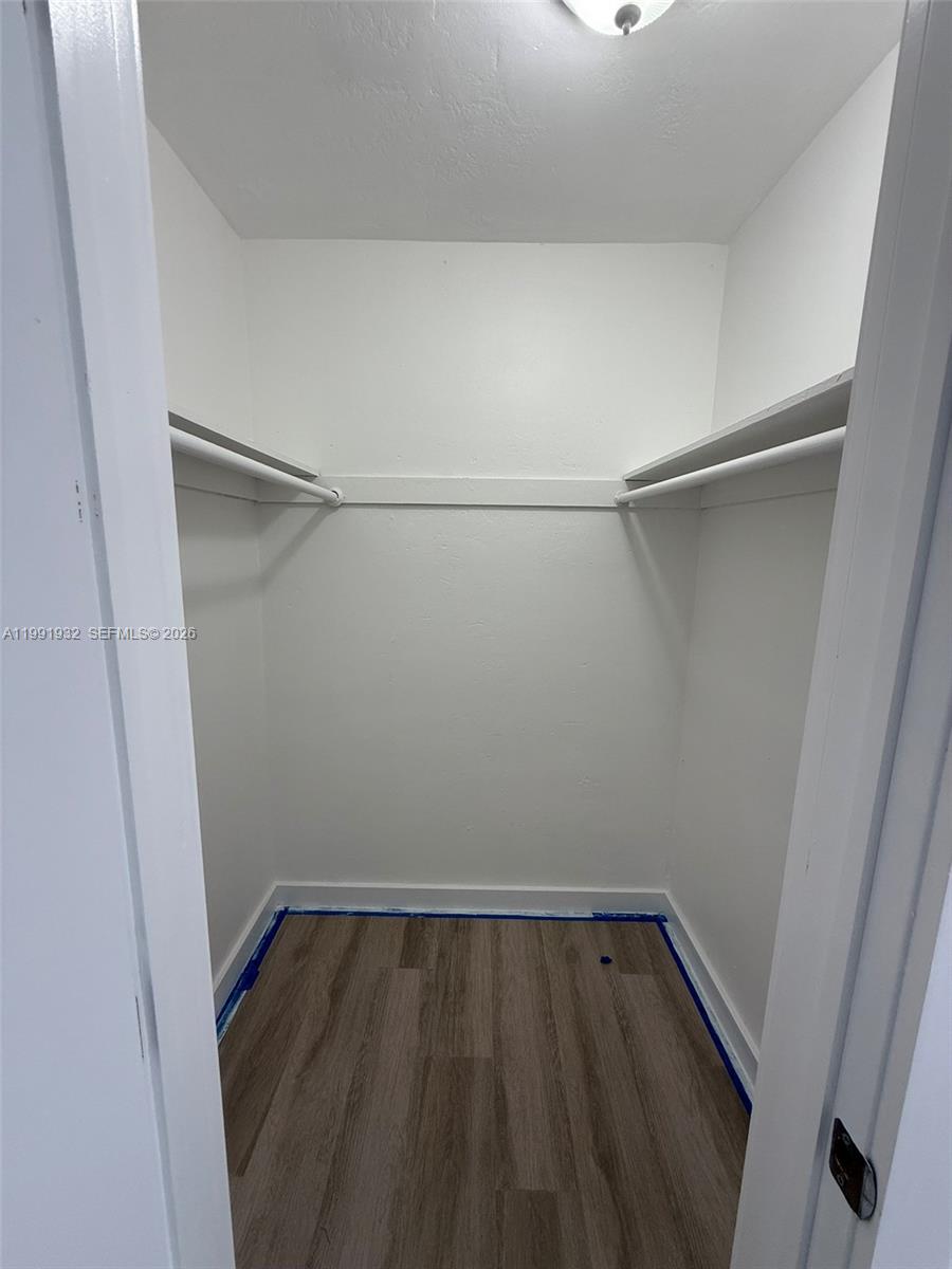 7251 Southwest 82nd Street, Unit 15 Miami, FL 33143 - Photo 10 of 15 a view of a room with wooden floor