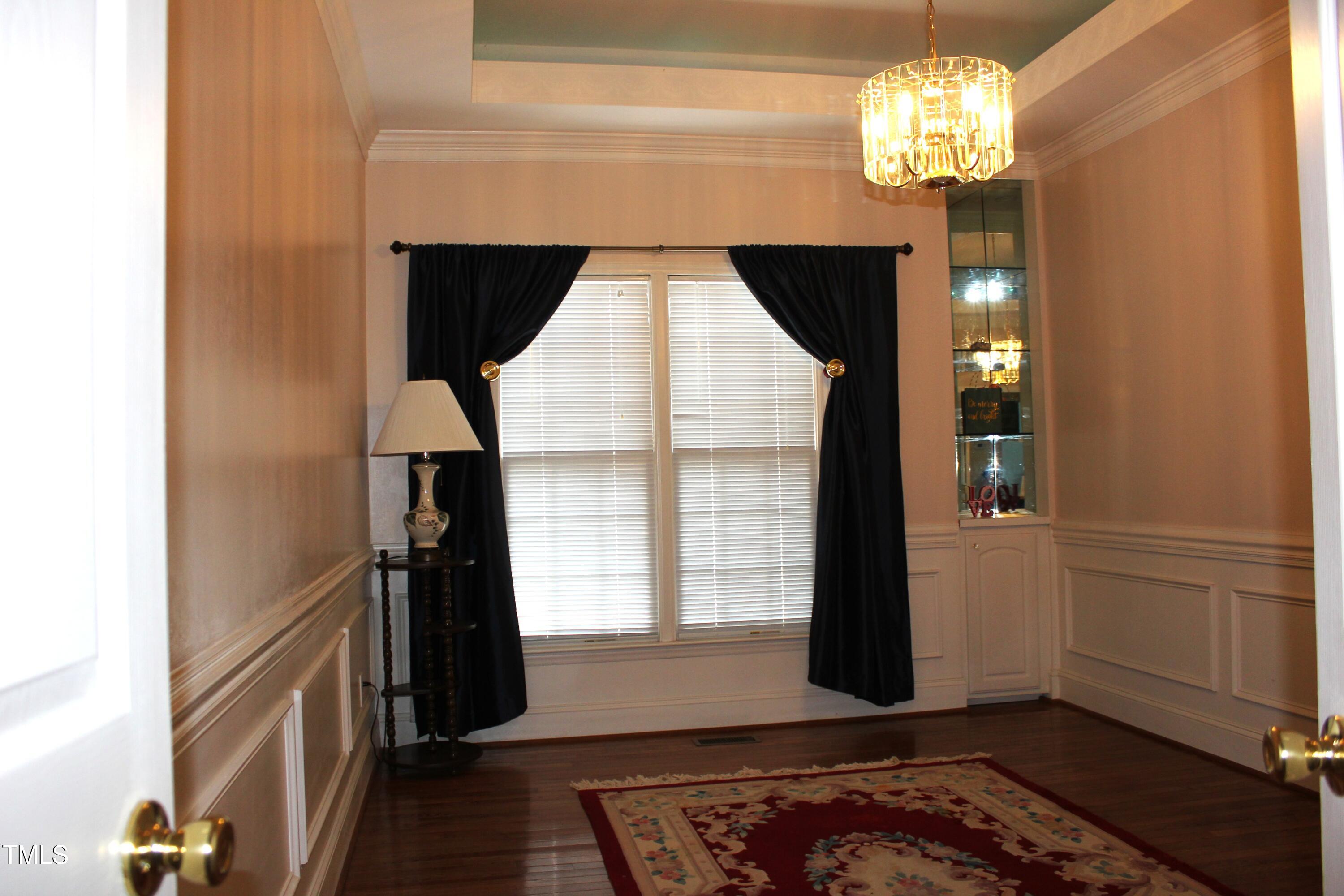 1508 High Holly Lane Raleigh, NC 27614 - Photo 25 of 46 a view of a livingroom with a chandelier wooden floor and a chandelier
