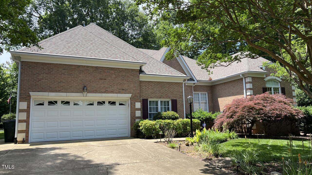 1508 High Holly Lane Raleigh, NC 27614 - Photo 5 of 46 a front view of a house with a garden