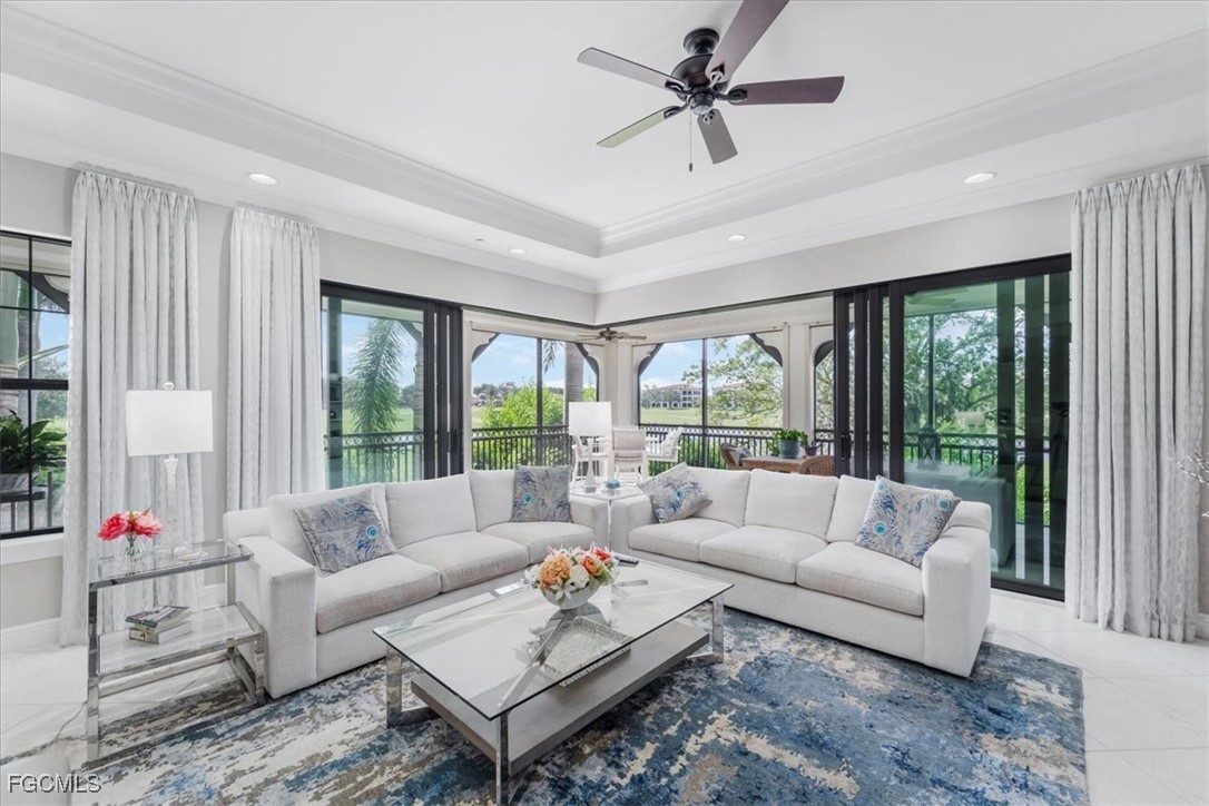 16432 Carrara Way, Unit 101 Naples, FL 34110 - Photo 18 of 50 a living room with furniture and a large window