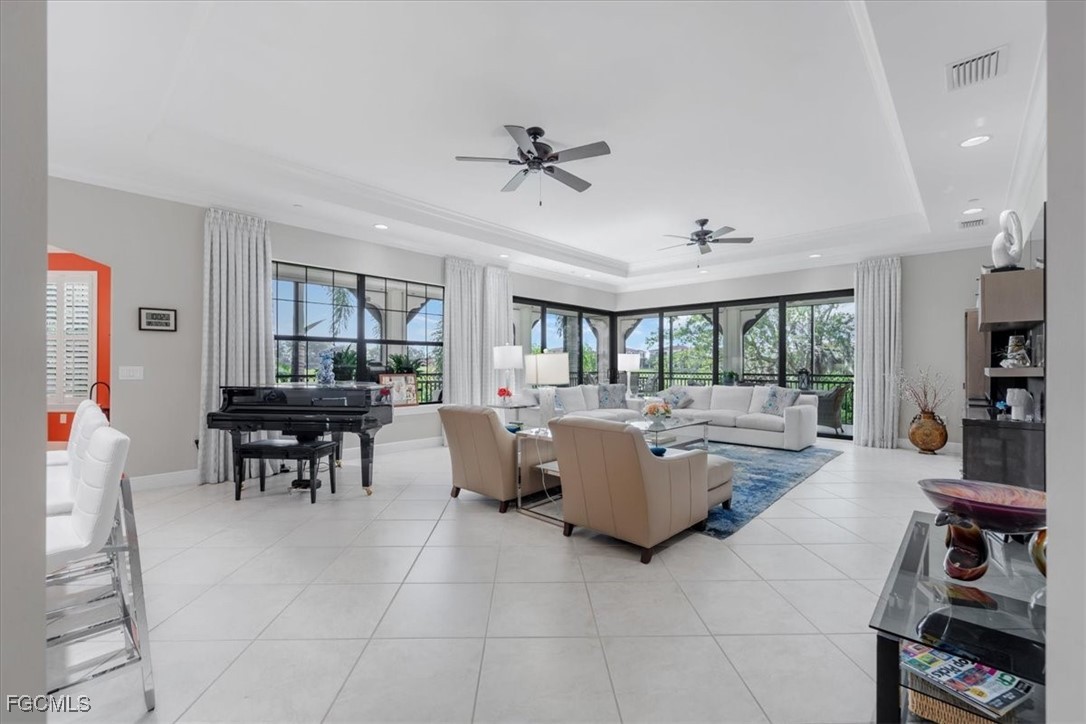 16432 Carrara Way, Unit 101 Naples, FL 34110 - Photo 19 of 50 a living room with furniture and a large window
