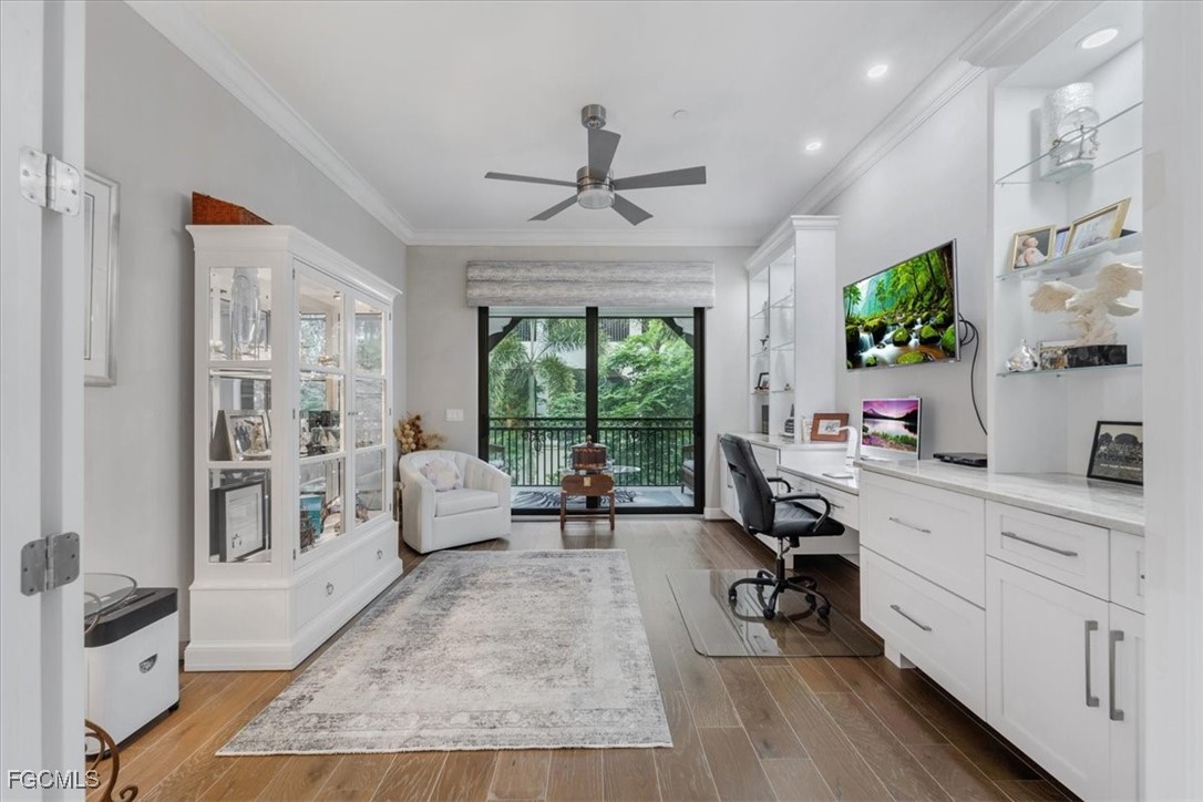 16432 Carrara Way, Unit 101 Naples, FL 34110 - Photo 23 of 50 a living room with furniture and a large window