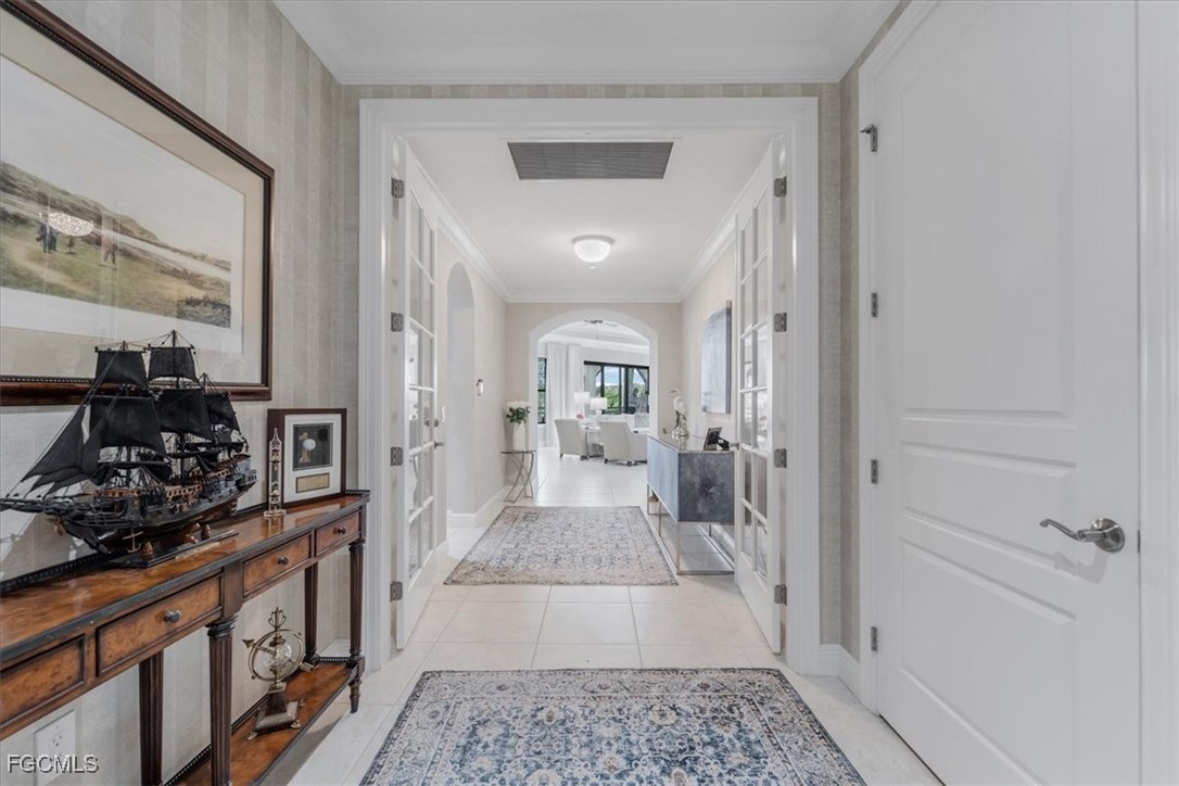 16432 Carrara Way, Unit 101 Naples, FL 34110 - Photo 3 of 50 a bathroom with a sink and a mirror