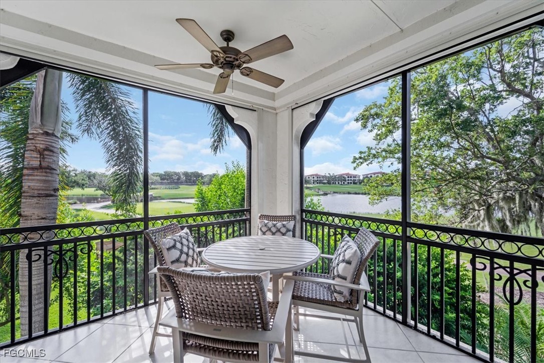 16432 Carrara Way, Unit 101 Naples, FL 34110 - Photo 39 of 50 a view of a porch with furniture and a yard