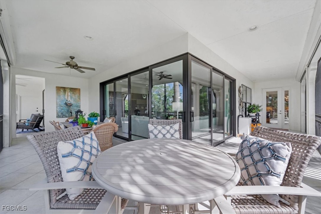 16432 Carrara Way, Unit 101 Naples, FL 34110 - Photo 41 of 50 a bed room with a bed and a large window