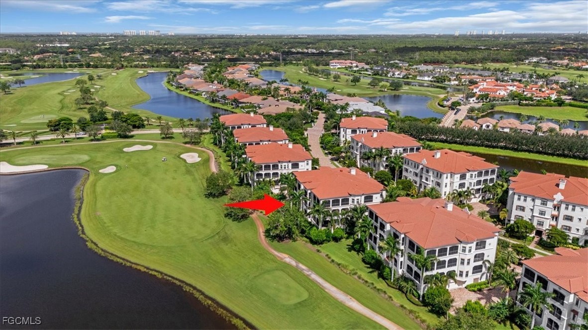 16432 Carrara Way, Unit 101 Naples, FL 34110 - Photo 47 of 50 an aerial view of residential houses with outdoor space