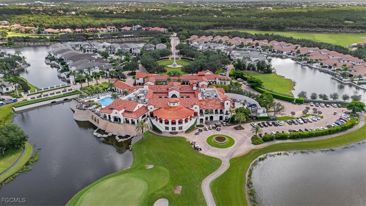 16432 Carrara Way, Unit 101 Naples, FL 34110 - Photo 48 of 50 an aerial view of a house with a lake view