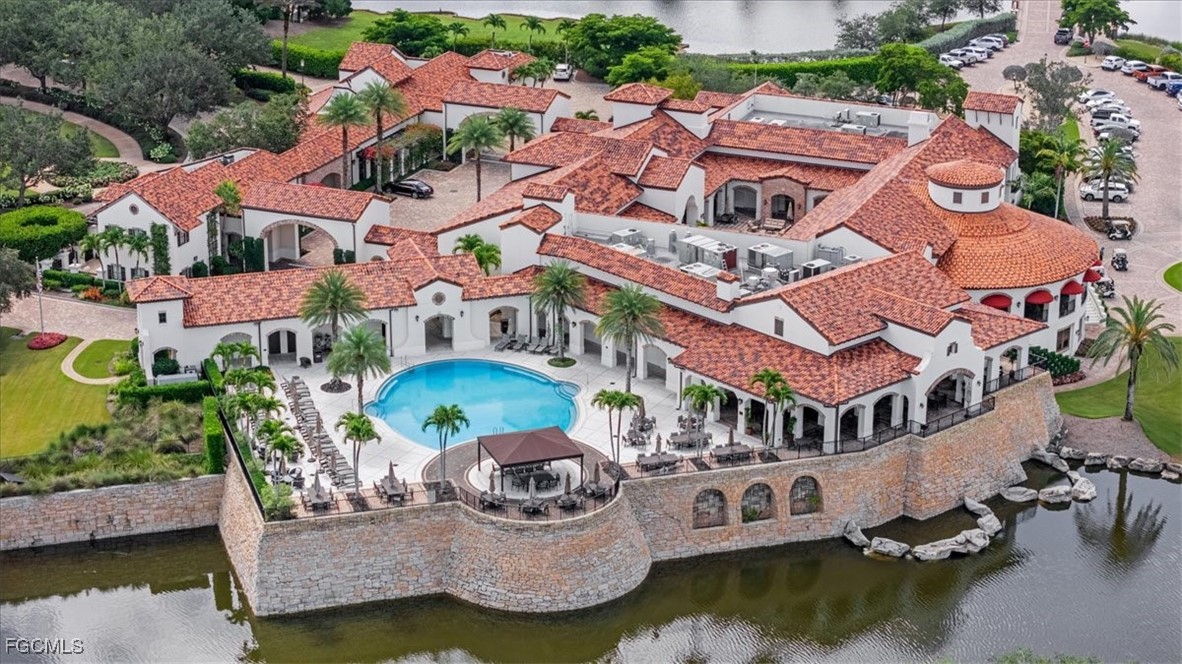 16432 Carrara Way, Unit 101 Naples, FL 34110 - Photo 49 of 50 an aerial view of house with yard swimming pool and outdoor seating