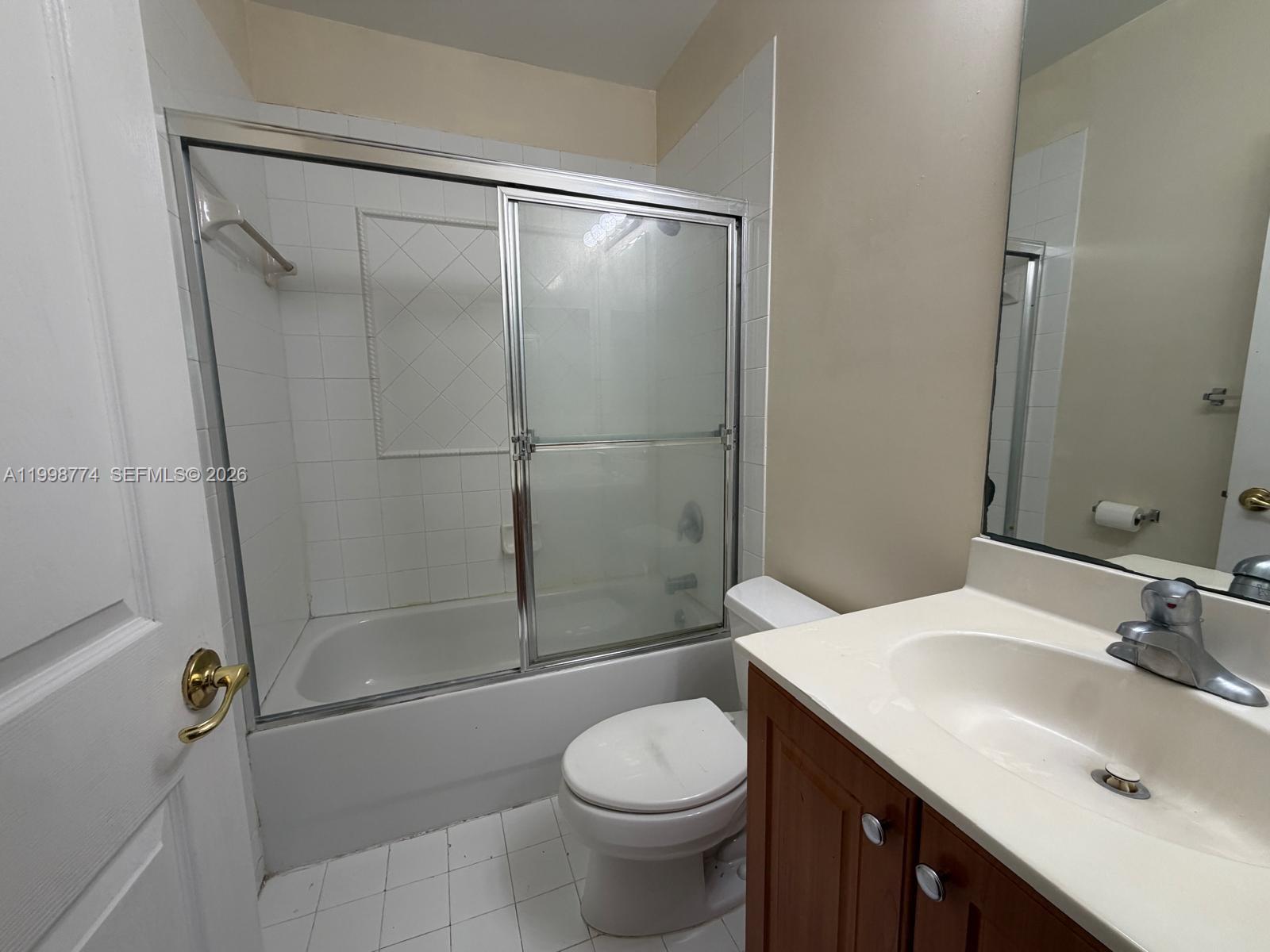 8246 Southwest 27th Street, Unit 103 Miramar, FL 33025 - Photo 13 of 17 a bathroom with a sink toilet and shower