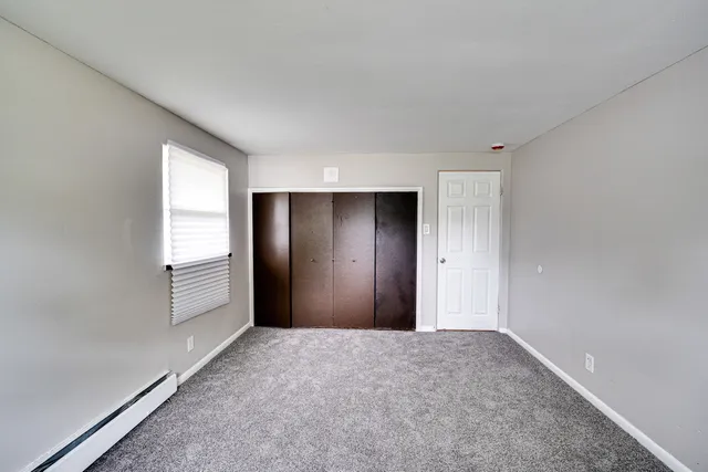 a view of an empty room and window