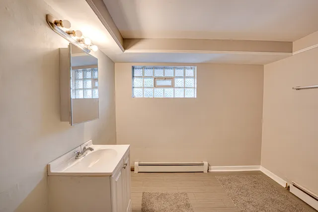 a bathroom with a sink and mirror