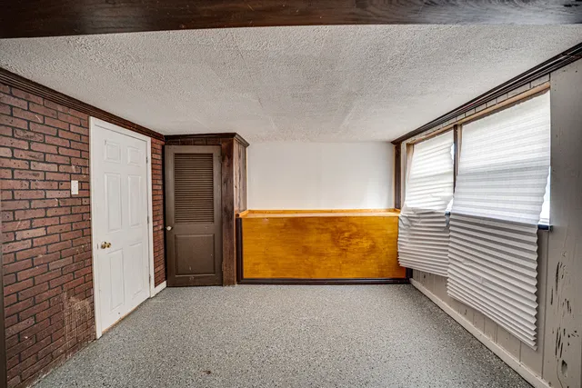 a view of an empty room with windows