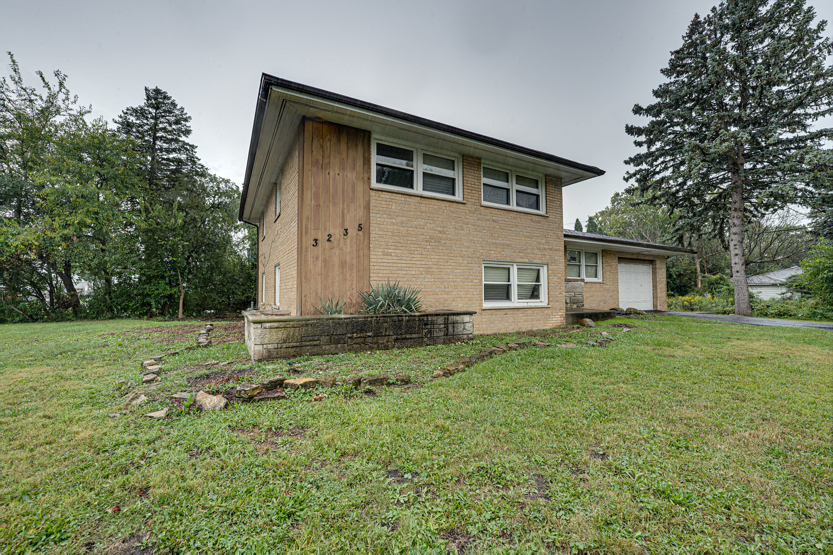 3235 West 157th Street Markham, IL 60428 - Photo 21 of 21 a view of a yard in front of a house with large trees