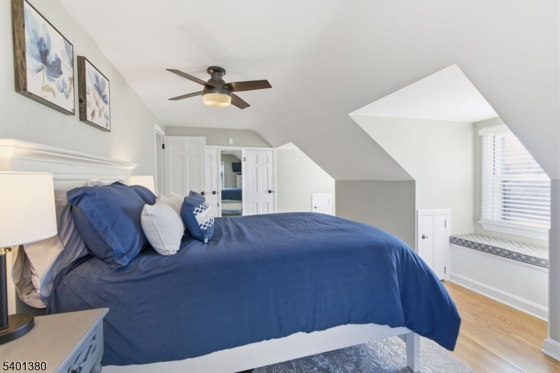 107 Chestnut Street Bound Brook, NJ 08805 - Photo 11 of 24 a living room with couches and kitchen view with wooden floor
