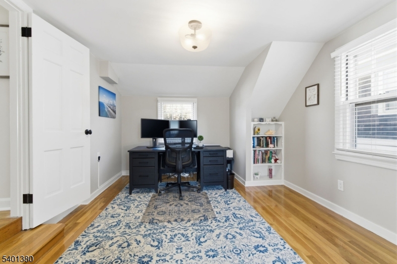 107 Chestnut Street Bound Brook, NJ 08805 - Photo 13 of 24 a view of a workspace with furniture and a rug