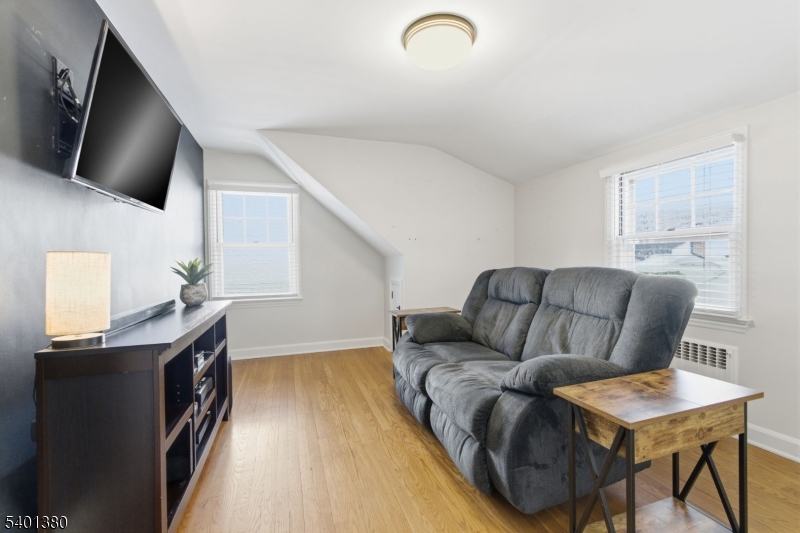107 Chestnut Street Bound Brook, NJ 08805 - Photo 15 of 24 a living room with furniture and a flat screen tv