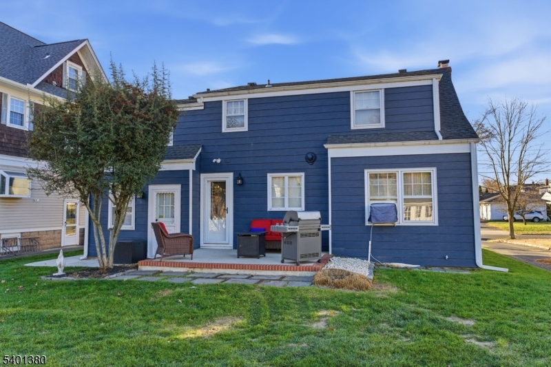 107 Chestnut Street Bound Brook, NJ 08805 - Photo 19 of 24 a front view of a house with a garden