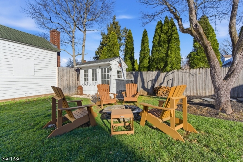 107 Chestnut Street Bound Brook, NJ 08805 - Photo 21 of 24 a view of a patio with table and chairs and potted plants
